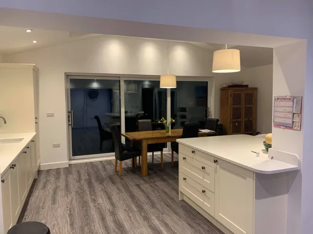 Cream Shaker kitchen with island and adjoining open-plan dining area