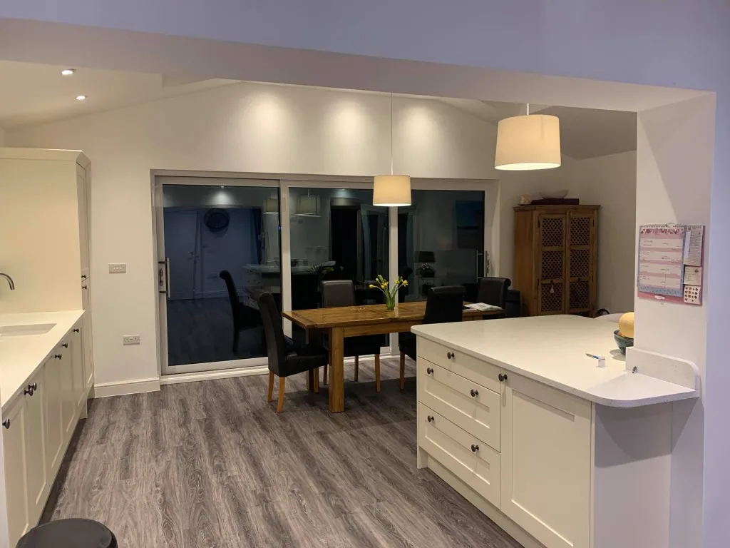 Cream Shaker kitchen with island and adjoining open-plan dining area