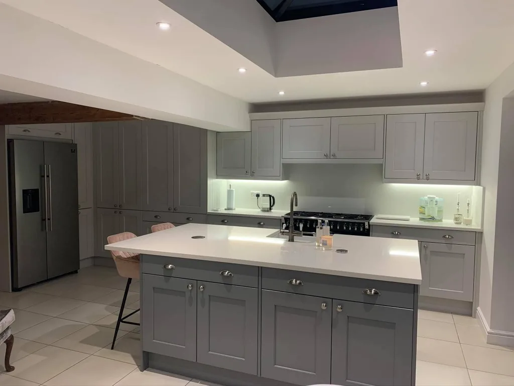 Grey Shaker kitchen with central island, bar stools and American-style fridge freezer