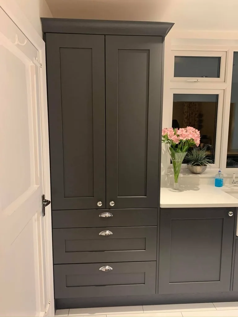 Dark grey painted Shaker larder cabinet with cup handles and drawers